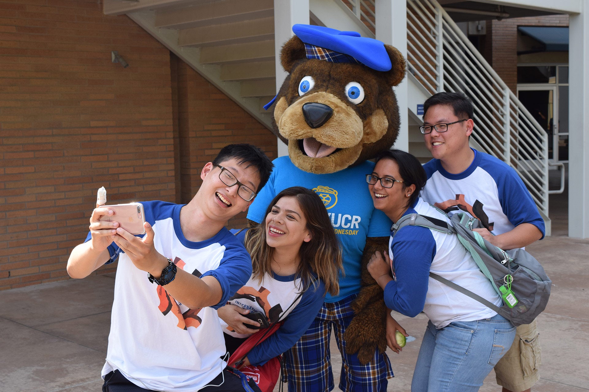 Group of UCR student leaders taking a selfie with Scotty Bear