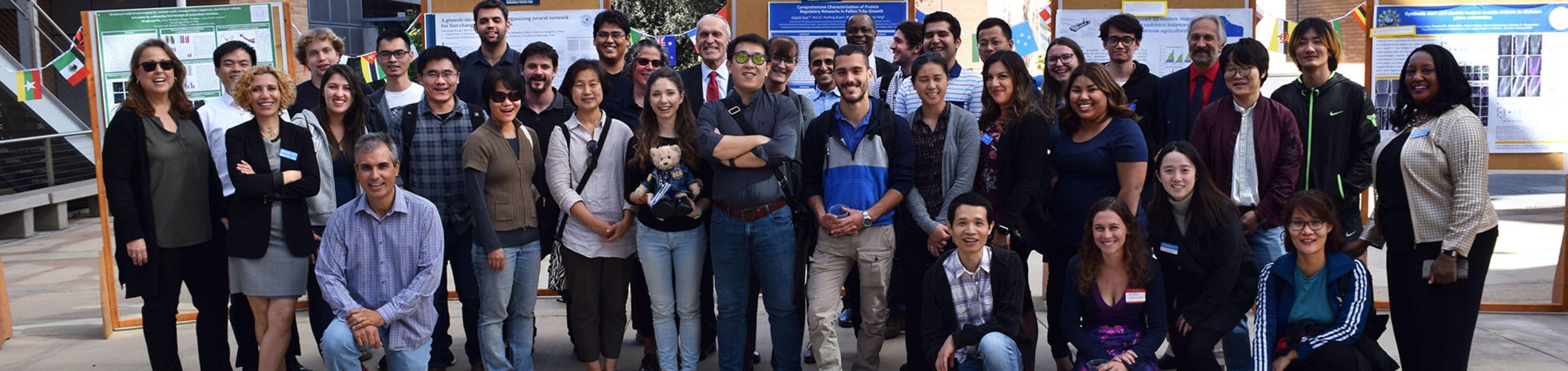 Large group of international scholars at UCR research poster fair