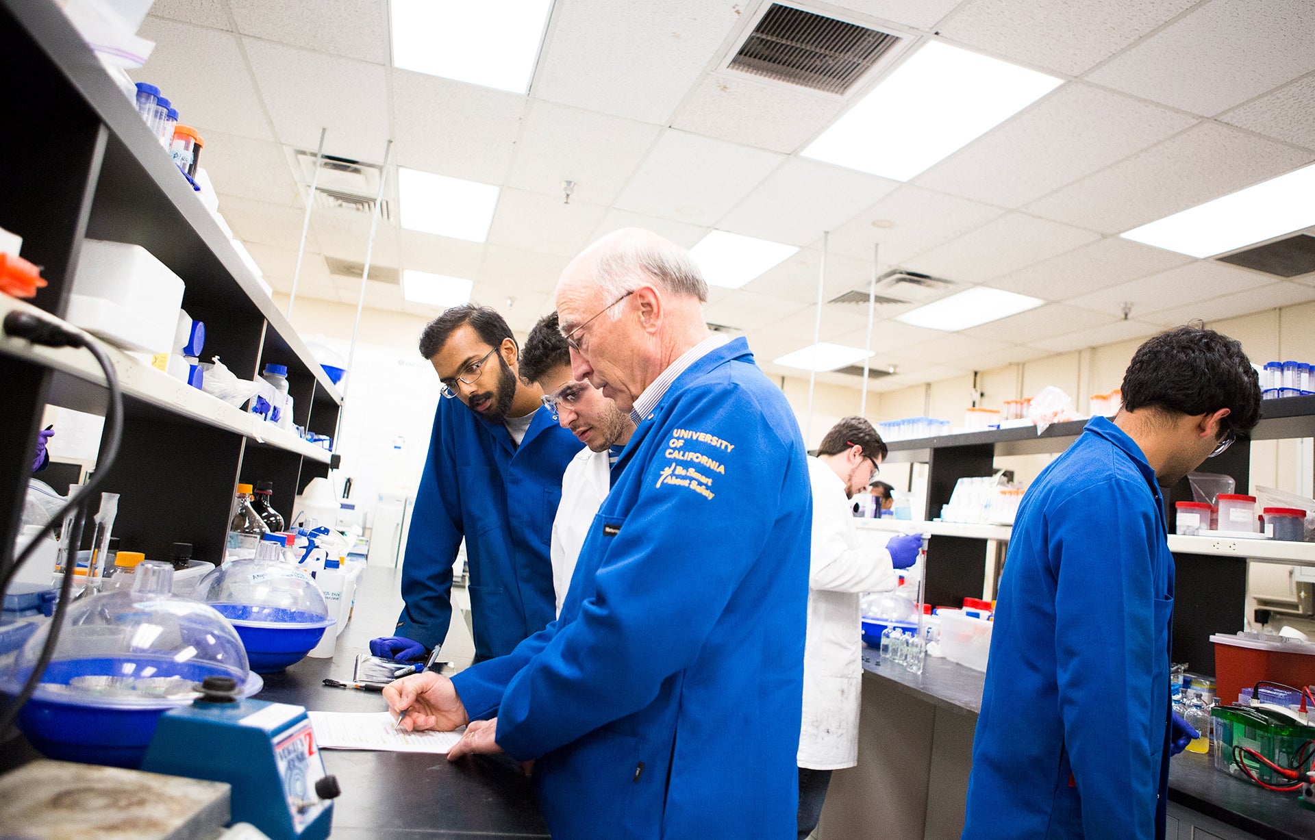 Students Working with Professor on Lab Works